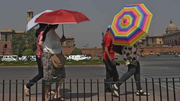 Women use umbrellas to protect themselves from the heat in New Delhi. (Ravi Choudhary/ HT File) Women use umbrellas to protect themselves from the heat in New Delhi. (Ravi Choudhary/ HT File)