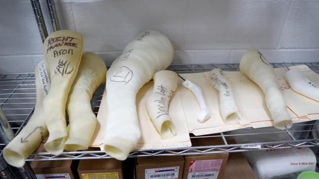 Various molds for animal prosthetics made by Derrick Campana of Animal Ortho Care sit upon a shelf at their facility. (Kevin Lamarque / Reuters) 
