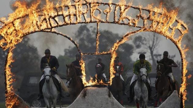 Nepalese army soldiers demonstrate their horse riding skills during the Ghode Jatra festival.  (AP/PTI) 