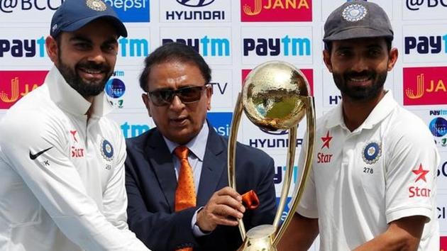 India's Virat Kohli (L) and Ajinkya Rahane (R) receive the Border-Gavaskar trophy after beating Australia in Dharamsala.(REUTERS)