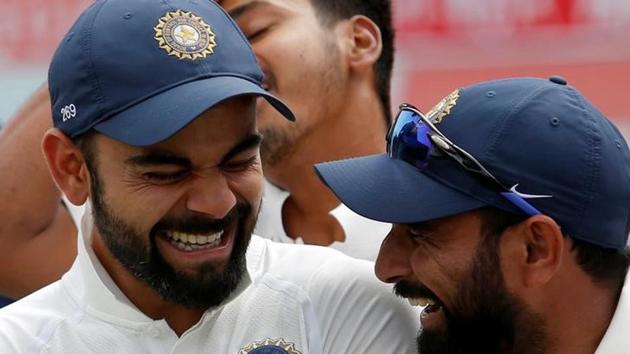 India's Virat Kohli and Mohammed Shami (R) shares a moment during the award ceremony after winning the series against Australia. (REUTERS) India's Virat Kohli and Mohammed Shami (R) shares a moment during the award ceremony after winning the series against Australia. (REUTERS)