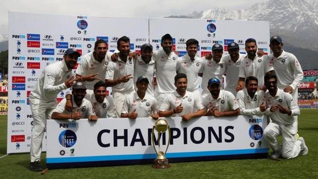 India cricket team players pose with the Border-Gavaskar Trophy after winning the four-match Test series against Australia cricket team in Dharamsala on Tuesday.(Reuters)