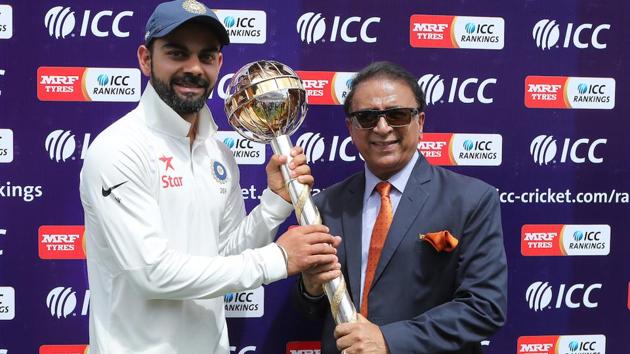 Virat Kohli receives the Test Championship Mace from Sunil Gavaskar. (BCCI) 
