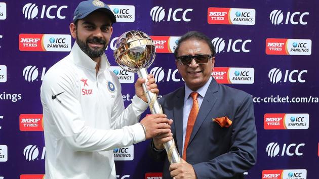 Indian cricket team captain Virat Kohli receives the ICC Test Championship mace from Sunil Gavaskar.(BCCI)