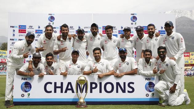 Indian cricket team players with the Border–Gavaskar Trophy after defeating Australia by eight wickets in the Dharamsala Test.(BCCI)