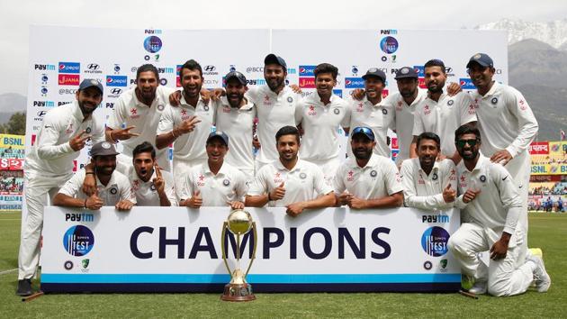 Indian cricket team players pose with the Border–Gavaskar Trophy in Dharamsala. (BCCI) 