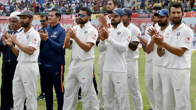 India skipper Virat Kohli with teammates at the award ceremony after winning the Test series against Australia at HPCA Stadium in Dharamsala on Tuesday.(PTI)