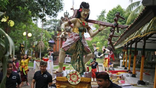 Children carry a giant effigy called ‘ogoh-ogoh’ representing evil spirits that need to be cleansed during a parade on the evening of the Day of Silence . (Dita Alangkara / AP) Children carry a giant effigy called ‘ogoh-ogoh’ representing evil spirits that need to be cleansed during a parade on the evening of the Day of Silence . (Dita Alangkara / AP)
