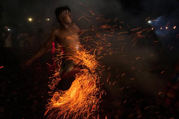 A Balinese Hindu runs through burning coconut husks during a ‘Mesabatan Api’ ritual on the eve of Nyepi, a day of silence for self-reflection to celebrate the new year, in Gianyar, Bali, Indonesia March 27, 2017. (Nyoman Budhiana/ Reuters) A Balinese Hindu runs through burning coconut husks during a ‘Mesabatan Api’ ritual on the eve of Nyepi, a day of silence for self-reflection to celebrate the new year, in Gianyar, Bali, Indonesia March 27, 2017. (Nyoman Budhiana/ Reuters)