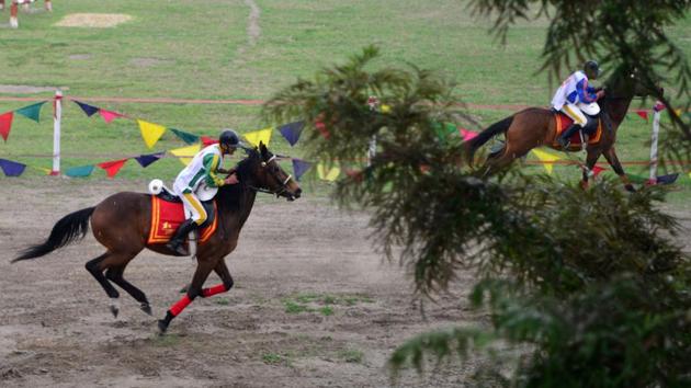 Nepalese soldiers take part in the Ghode Jatra (horse race) festival in Kathmandu. The Nepalese army celebrates the Ghode Jatra festival every year with various equestrian activities. (Prakash Mathema/AFP) 