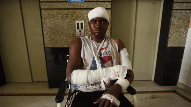 One of the four Nigerians who was wounded in an attack by a mob in Greater Noida.(Virendra Singh Gosain/ HT photo)