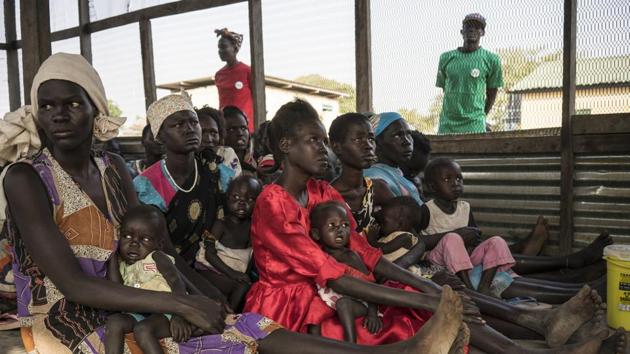In this photo taken Monday, March 13, 2017, Iman Diing, 20, center, holds her 13-month-old baby daughter Alakaii at a UNICEF-supported outpatient therapeutic program for the malnourished, near Aweil, in South Sudan. (AP Photo) In this photo taken Monday, March 13, 2017, Iman Diing, 20, center, holds her 13-month-old baby daughter Alakaii at a UNICEF-supported outpatient therapeutic program for the malnourished, near Aweil, in South Sudan. (AP Photo)