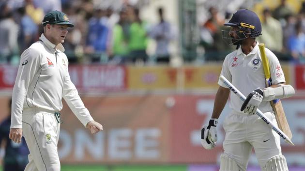 Australia cricket team captain Steve Smith (left) walks towards India cricket team's stand-in skipper Ajinkya Rahane after the match in Dharamsala on Tuesday(AP)