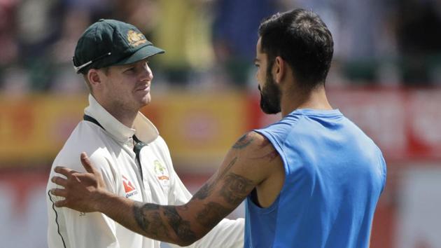 Australia skipper Steven Smith (left) and Virat Kohli did shake hands after the match but the India skipper said in Dharamsala that he would no longer consider the Aussies his ‘friends’.(AP)