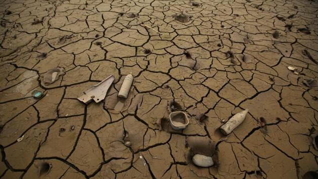 Bottles and containers lie in mud after rivers breached their banks due to torrential rains, causing flooding and widespread destruction in Carapongo Huachipa, Lima, Peru. (Mariana Bazo/REUTERS)