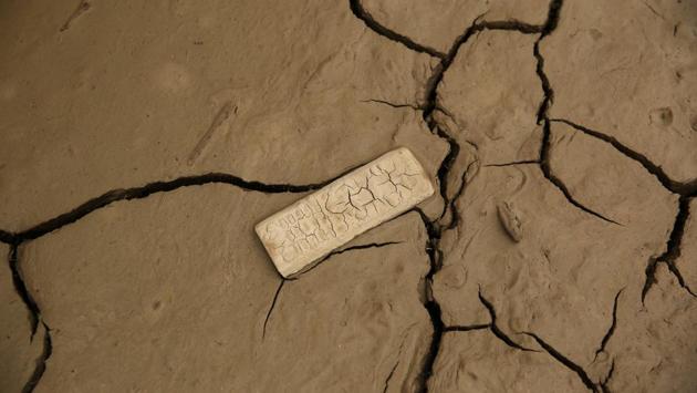 A remote control lies in the mud. (Mariana Bazo/REUTERS)