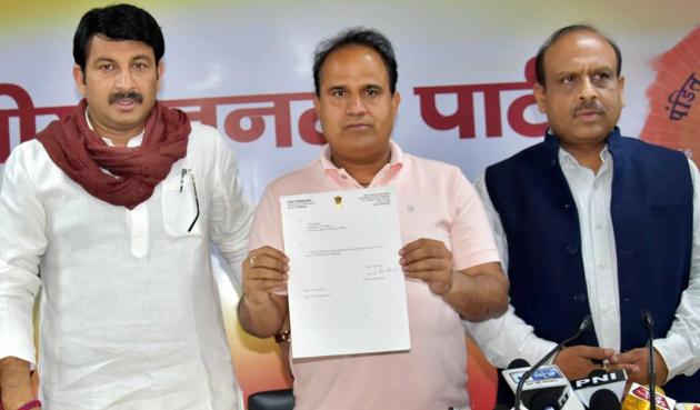 AAP MLA from Bawana Ved Prakash joined the BJP in New Delhi on Monday (PTI Photo) AAP MLA from Bawana Ved Prakash joined the BJP in New Delhi on Monday (PTI Photo)