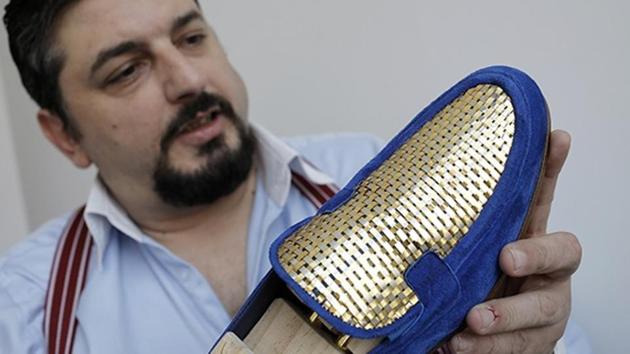 Antonio Vietri, artisan and founder of A&V Fashion, shows a men’s shoe as part of his collection “Gold”. (AFP) Antonio Vietri, artisan and founder of A&V Fashion, shows a men’s shoe as part of his collection “Gold”. (AFP)