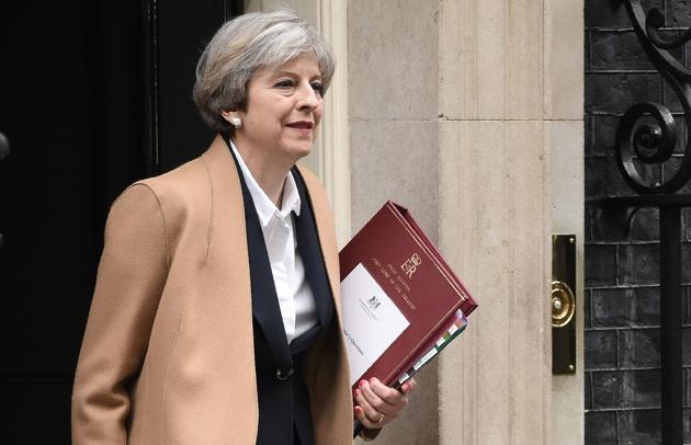 British Prime Minister Theresa May leaves 10 Downing Street for the Houses of Parliament on Wednesday. (AFP) British Prime Minister Theresa May leaves 10 Downing Street for the Houses of Parliament on Wednesday. (AFP)