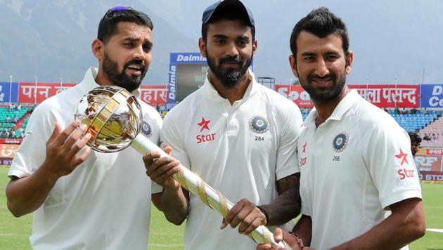 Murali Vijay, KL Rahul and Cheteshwar Pujara with the Test Championship mace in Dharamsala.(BCCI)