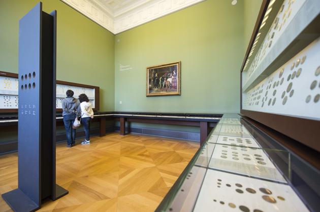 Visitors stand in the room where a 100 kilogram-heavy gold coin was displayed in the Bode Museum, in Berlin, Germany. (AP) Visitors stand in the room where a 100 kilogram-heavy gold coin was displayed in the Bode Museum, in Berlin, Germany. (AP)