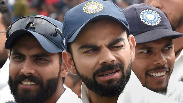 Virat Kohli reacts during the presentation ceremony after winning the series against Australia in Dharamsala.(PTI)