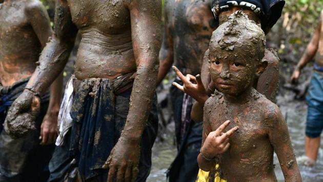 Mebuug-buugan is a tradition from Kedonganan Village. This tradition purpose is to make the bad energy running out from everybody who doing this tradition. (Sonny Tumbelaka / AFP) Mebuug-buugan is a tradition from Kedonganan Village. This tradition purpose is to make the bad energy running out from everybody who doing this tradition. (Sonny Tumbelaka / AFP)