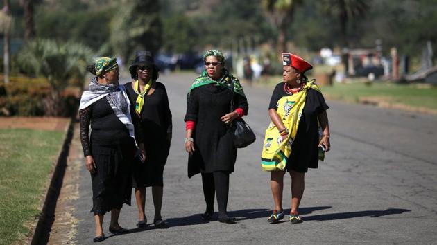 Mourners arrive for the funeral.  Kathrada denied all charges against him and was convicted on only one count, sabotage. He was released from prison in 1989, just months before Mandela himself walked free.  (Siphiwe Sibeko/REUTERS) 