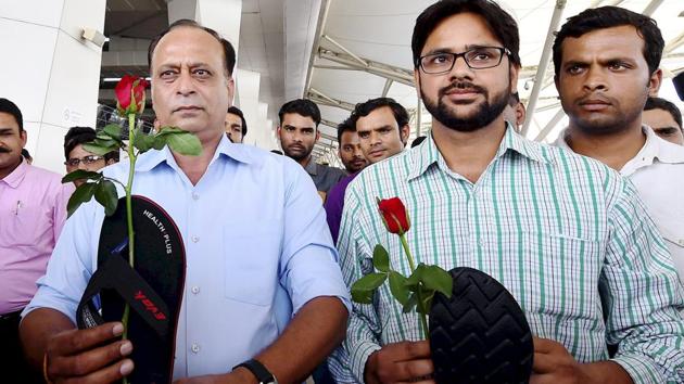 Protesters hold roses and slippers as they stage a demonstration against Shiv Sena MP Ravindra Gaikwad for his misbehaviour with an Air India staffer, at IGI Airport in New Delhi. (PTI File) Protesters hold roses and slippers as they stage a demonstration against Shiv Sena MP Ravindra Gaikwad for his misbehaviour with an Air India staffer, at IGI Airport in New Delhi. (PTI File)