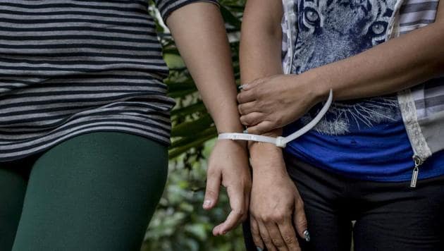 Two women who are accused by police of being part of the Mara Salvatrucha gang are presented before the media at police headquarters in San Salvador, El Salvador.(AP File Photo)
