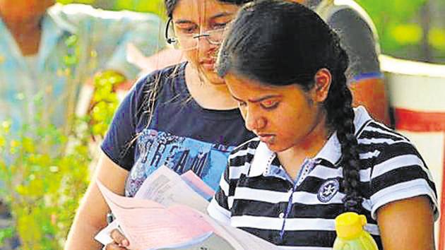 INDORE, India - May 22, 2016: Students outside the examination centre after Joint Entrance Examination (JEE) in INDORE, India, on Sunday, May 22, 2016. (Photo by Shankar Mourya/ Hindustan Times) (with Milind story)(Hindustan Times)