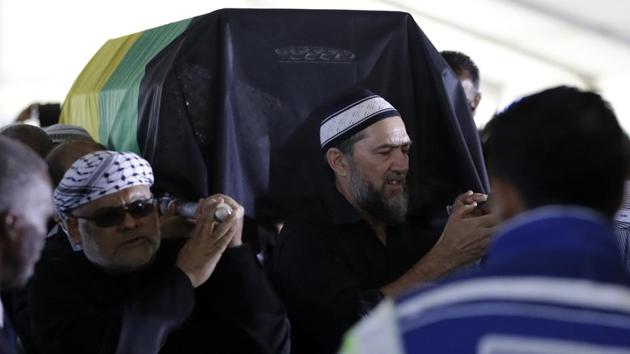 Men carrying the coffin of Ahmed Kathrada, during the funeral service. Kathrada was born in 1929 to a scholarly Muslim family and became involved in political activism at the age of 11. He joined the Communist Party in the early 1940s and, as general-secretary of the Transvaal Indian Congress, was instrumental in linking it to the ANC. He later became a member of the ANC military wing’s high command. (Themba Hadebe/AP) 