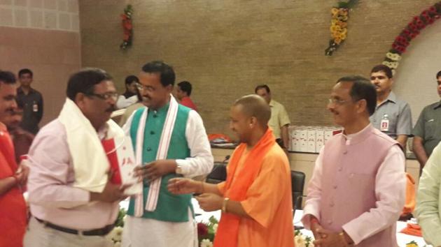 Chief minister Yogi Adityanath along with deputy CMs Dinesh Sharma and KP Maurya at his official residence on Wednesday. (HT Photo) Chief minister Yogi Adityanath along with deputy CMs Dinesh Sharma and KP Maurya at his official residence on Wednesday. (HT Photo)