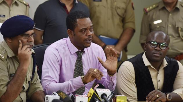 Representative members of Africans and Kenyan high commission along with Dharmendra Singh Yadav ,SSP Gautam Budh Nagar, during a press conference in Greater Noida on Thursday.(Virendra Singh Gosain/HT Photo)