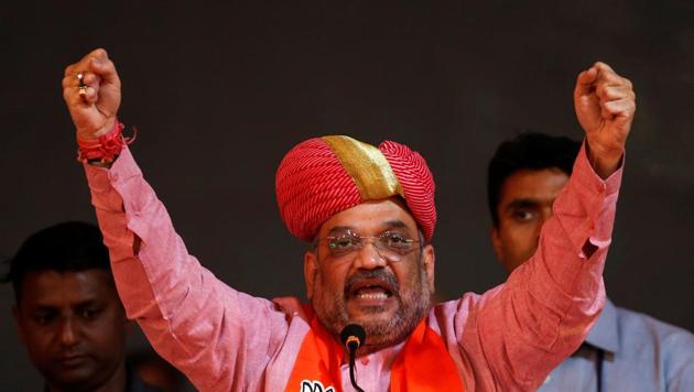 Amit Shah gestures as he is felicitated by BJP party workers for the party’s victory in the Uttar Pradesh assembly elections, in Ahmedabad. (Reuters Photo) Amit Shah gestures as he is felicitated by BJP party workers for the party’s victory in the Uttar Pradesh assembly elections, in Ahmedabad. (Reuters Photo)