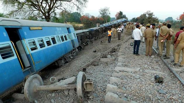 Rescue workers and officials are watched by bystanders as they inspect derailed coaches of the Mahakaushal Express at Mahoba some 140kms south-west of Kanpur on March 30. (AFP Photo) Rescue workers and officials are watched by bystanders as they inspect derailed coaches of the Mahakaushal Express at Mahoba some 140kms south-west of Kanpur on March 30. (AFP Photo)