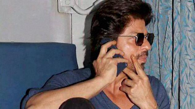 Actor Shah Rukh Khan travels from Mumbai to Delhi in a train while promoting his film Raees, during a stopover at Vadodara. (PTI Photo) Actor Shah Rukh Khan travels from Mumbai to Delhi in a train while promoting his film Raees, during a stopover at Vadodara. (PTI Photo)