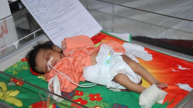 A week-old, Khushi, was rescued by villagers and police from a dry 18-foot well on Tuesday evening, where she was thrown by her mother.(HT Photo)