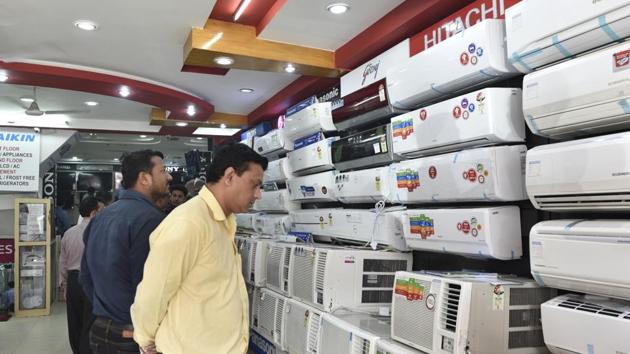 Customers check out air conditioners at a showroom in New Delhi on Friday. (Mohd Zakir/ HT Photo) Customers check out air conditioners at a showroom in New Delhi on Friday. (Mohd Zakir/ HT Photo)