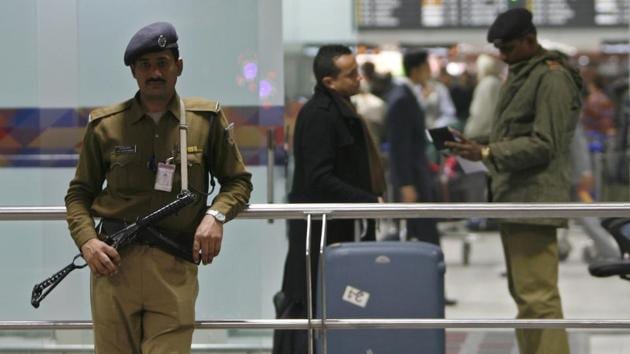 A paramilitary soldier verifies a passenger as another stands guard at the international airport in New Delhi.(REUTERS File)