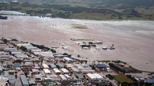 this image shows an aerial view of the flooding in the northern New South Wales town of Lismore after the area was hit by Cyclone Debbie. Tens of thousands of people have been evacuated from towns in two Australian states and authorities are searching for several missing residents amid severe flooding as the ex-tropical cyclone moved offshore. (AFP) this image shows an aerial view of the flooding in the northern New South Wales town of Lismore after the area was hit by Cyclone Debbie. Tens of thousands of people have been evacuated from towns in two Australian states and authorities are searching for several missing residents amid severe flooding as the ex-tropical cyclone moved offshore. (AFP)