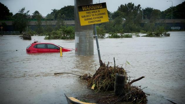 Submerged cars sit abandoned in a flooded car-park in Toombul. (Patrick Hamilton/AFP) Submerged cars sit abandoned in a flooded car-park in Toombul. (Patrick Hamilton/AFP)