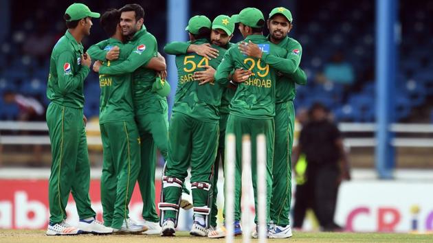 Pakistan's cricketers celebrate their victory at the end of the second of four-T20I-match between West Indies and Pakistan at the Queen’s Park Oval in Port of Spain, Trinidad. Get cricket score of the West Indies vs Pakistan 2nd T20I from Port of Spain here.(AFP)