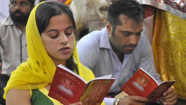 Devotees praying on the occasion of Navratri festival at Durga Mata temple in Ludhiana. (Gurminder Singh/HT)