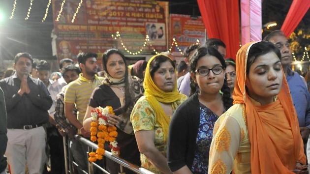 Devotees standing in a queue to offer prayers at Durga Mata temple near Jagraon bridge in Ludhiana. (Gurminder Singh/HT)