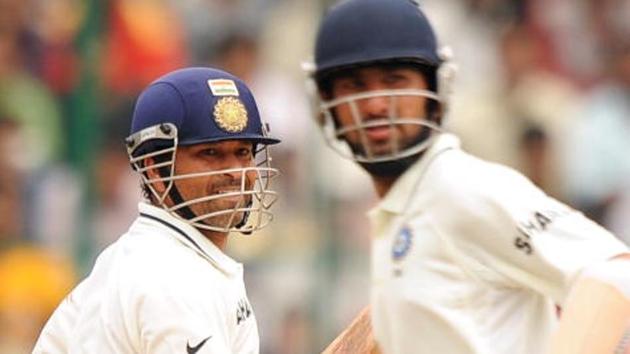 Sachin Tendulkar (L) called Cheteshwar Pujara (R) a silent warrior for the quiet manner in which he goes about his business of grafting long innings.(AFP/Getty Images)