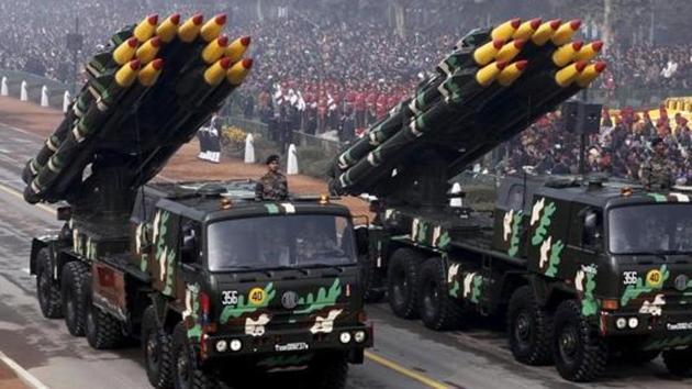 Indian army officers stand on vehicles displaying missiles during the Republic Day parade in New Delhi.(REUTERS)