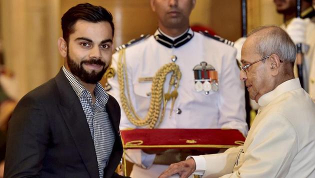 President Pranab Mukherjee confers the Padma Shri on Indian cricket team captain Virat Kohli at the Rashtrapati Bhavan in New Delhi on Thursday.(PTI)