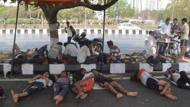 Tired with the long wait, a few candidates take a nap. (Prashant Waydande/HT )