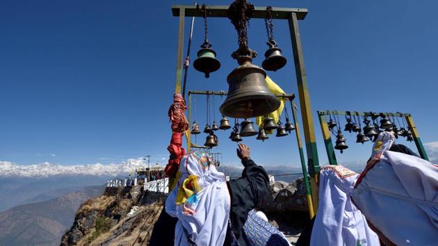 Not far from the road to the Kedarnath pilgrimage lies the relatively unknown temple of Karthik Swami above the town of Rudraprayag in Uttarakhand. The site sits at an altitude of over 10,000 feet offering a unique panorama of Garhwal’s majestic Himalayan peaks. Each year while hundreds of pilgrims throng the Char Dham yatra routes, locals make their way to this revered temple to seek blessings from the elder son of Lord Shiva, Kartikeya. (Gurinder Osan/HT PHOTO)